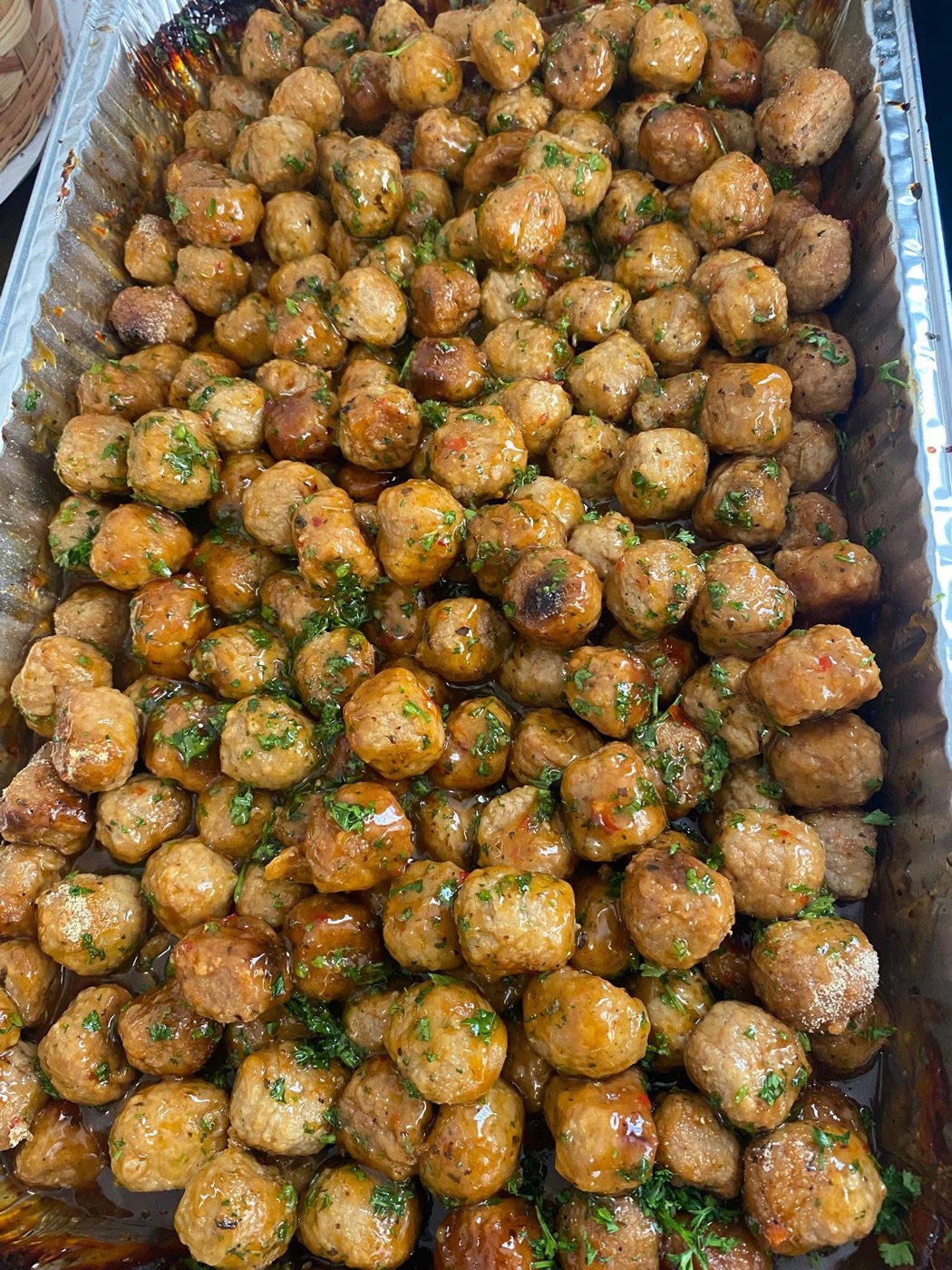 A tray of glazed meatballs