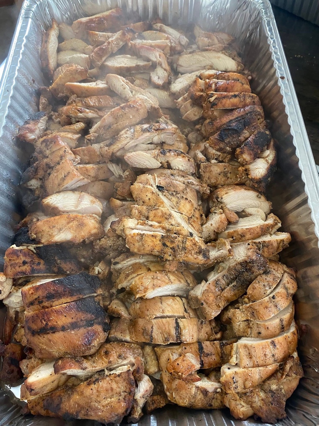 A full pan of smoked chicken